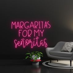 there is a neon sign that says margaritas for my sentas on the wall