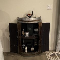 PRICES MAY VARY. Barrel Dreams is now selling the beautiful 1/2 wine barrel storage cabinet for indoor or outdoor use. Our wine barrel 1/2 storage cabinet is crafted from 200-year-old French Oak wood, this cabinet is both sturdy and elegant. The barrel head may display unique markings from its cooperage or vineyard origins, adding to its authentic appeal. This is a beautiful way to store your wine and wine glasses. Inside, the barrel boasts the rich stain of either red or white wine. It also has a shelf made from a wine barrel top. Each cabinet is custom-made and features Double French Doors. Dimensions: 35" Tall x 28" Wide x 14" Deep. 71 lbs Your half storage cabinet will come natural with no finish. Upgrades: Weatherproof Oil; Golden Oak; Dark Walnut; Espresso; Polyurethane; Switch to Wh Wine Barrel Storage, Wine Barrel Dog Bed, Wine Barrel Coffee Table, Bar Buffet Cabinet, Barrel Storage, Wine Barrel Furniture, Barrel Bar, Double French Doors, Home Bar Furniture