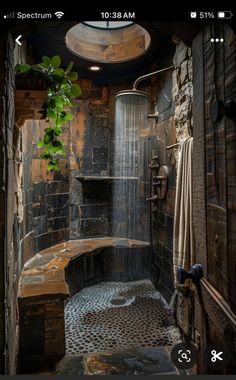 an image of a shower in the middle of a room with stone walls and flooring