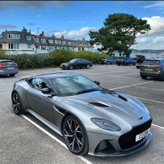 a silver sports car parked in a parking lot