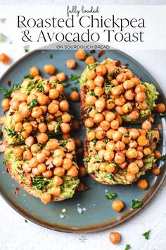 baked chickpeas with avocado and cilantro on a blue plate