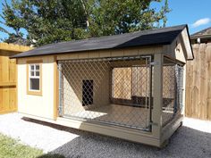 a dog house with a fence around it