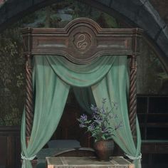 there is a bed with a canopy and flowers in the vase on top of it