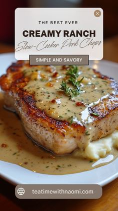 a white plate topped with meat covered in gravy