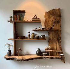 the shelves are made out of wood and have vases, bookshelves, and other items on them