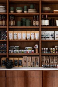 the shelves are full of spices and other items