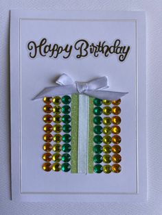 a happy birthday card with beads on it