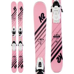 the pink skis are ready to be used for skiing and snowboarding in the winter