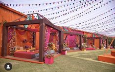 an outdoor wedding venue decorated in bright colors