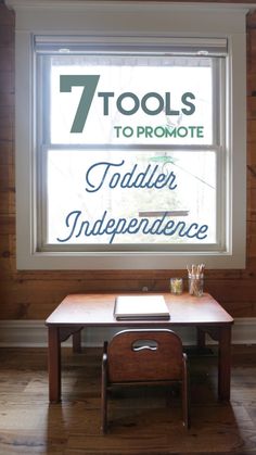 a wooden table in front of a window with the words 7 tools to promote toddler independence