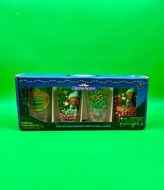 an unopened box with three different items in it on a green background,