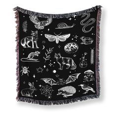 a black and white tapestry with various animals on it