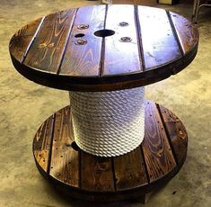 two tiered wooden table with white rope on top