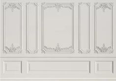 an image of a white wall with decorative paneling