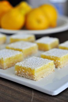 several pieces of lemon cake on a white plate