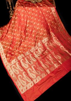 The opulent Tanchoi weave, believed to originate from China, is a testament to the skill of master weavers. Woven with intricate Jamawar patterns, this weaving technique ensures there are no cut or floating threads visible in the back, showcasing meticulous craftsmanship.  This beautiful saree boasts a stunning interplay of colors in a trendy paisley pattern, adding a contemporary touch to its traditional charm. Crafted from soft pure satin silk, the fabric exudes luxury and elegance. Highlighted by a lustrous Tanchoi border, this saree is a true masterpiece, blending timeless beauty with impeccable artistry. SILK MARK CERTIFIED This saree is ready to wear with fall and pico done. Handmade silk tassels adorn the pallu and add more grace to it. An unstitched blouse fabric is included. *Note Silk Tassels, Banarasi Saree, Satin Silk, Banarasi Sarees, Beautiful Saree, Blouse Fabric, Paisley Pattern, Saree Wedding, Salwar Kameez