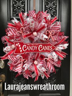 a candy cane wreath on the front door