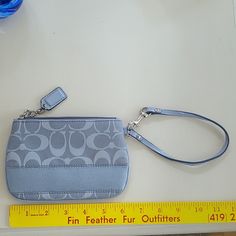 Coach Grey Signature Wristlet Like New Condition Never Used Coach Rectangular Wristlet With Zipper Pouch, Coach Zipper Pouch Wristlet, Coach Zipper Wristlet, Coach Wristlet With Zipper Pouch, Coach Handheld Wristlet With Wrist Strap, Coach Wristlet With Zipper Pouch For Daily Use, Coach Bags, Mini Bag, Like New