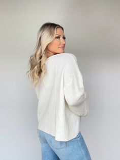 This Delightful Knit Sweater is the perfect addition to your wardrobe. Featuring a v neckline and ribbed detailing, this garment is luxuriously crafted with textured ultra-stretchy softness. Noticeably bright, cozy and relaxed fit, with bell sleeves, this sweater is perfect for an elevated casual brunch date, shopping, dinner, or work wear. Classy and sophisticated, it is a timelessly versatile piece. 50% Acrylic 30% Nylon 20% Cotton Hand wash cold. Soft Knit V-neck Top, Chic Knit V-neck Sweater With Ribbed Neckline, White V-neck Sweater With Ribbed Neckline, White V-neck Cable Knit Cardigan, Soft V-neck Cardigan For Loungewear, Soft Texture V-neck Cardigan For Loungewear, V-neck Cardigan With Soft Texture For Loungewear, Cream Ribbed V-neck Knit Top, Comfortable V-neck Cardigan For Loungewear