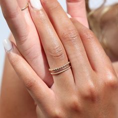 Model wearing 14k gold fill SoHo Ring Set on the middle finger. This Ring set highlights each one of our go to stacking rings including the stacking ring, spiral ring, and sequins ring. These rings are made to live in made to wear everyday. Elegant Hammered Stackable Promise Rings, Elegant Stacked Rings As A Gift, Elegant Stackable Rings As Gift, Elegant Gift Stackable Rings, Modern Twist Stackable Adjustable Midi Rings, Elegant Hammered Midi Rings For Wedding, Adjustable Stackable Midi Rings With A Modern Twist, Modern Twist Adjustable Stackable Midi Rings, Elegant Stacked Rings For Everyday