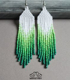 These green fringe earrings are made of high-quality Czech beads and strong synthetic thread. They are elegant, fashionable, and highly versatile, suitable for everyday wear. Features: Sterling silver components Color: green, white. This item is currently in stock. You must be completely satisfied. If you find merchandise unsatisfactory for any reason, return it within 10 days and your money will be refunded without questions. These earrings in black color https://www.etsy.com/listing/564959067/ Green Dangle Tassel Earrings For Summer, Green Fringe Earrings For Summer, Green Tassel Jewelry For Summer, Elegant Green Tassel Earrings For Summer, Summer Green Tassel Jewelry, Green Handwoven Dangle Beaded Earrings, Green Handwoven Beaded Dangle Earrings, Handmade Green Tassel Earrings For Summer, Green Handmade Tassel Earrings For Summer