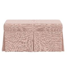 a pink table cloth with two ruffled edges