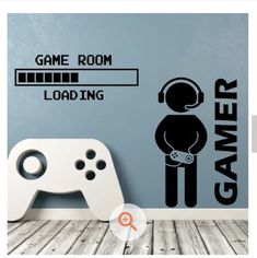 a game room wall decal with a video game controller and sticker on the wall