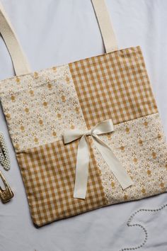 a brown and white bag sitting on top of a table next to a silverware