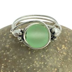 You choose the size for this handmade sterling and 8mm cultured frosted green sea glass wrap ring! Perfect on its own, or stack it! Choose your size from the menu - if you don't see yours, just ask - we love custom orders! Sea glass soothes and brings calmness to the wearer. It also invokes tranquility with its beachy vibe. Perfect bridesmaids' gift for a seaside ceremony! Every bead is different, so your ring might not be EXACTLY like the one pictured, but it will be very, very similar. And it will be its own special self. Unique Adjustable Green Stackable Rings, Adjustable Silver Ring With Sea Glass, Handmade Adjustable Sea Glass Rings, Adjustable Sea Glass Ring Jewelry, Adjustable Seafoam Jewelry For Gifts, Adjustable Seafoam Jewelry As Gift, Healing Gemstone Bracelets, Glass Wrap, Zebra Jasper