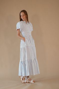 Ingrid Striped Dress – Twirl Boutique Striped Midi Dress With Smocked Bodice, Striped Maxi Dress For Daywear, Striped Vacation Dress With Smocked Back, Striped Dress With Smocked Back For Vacation, Striped V-neck Maxi Dress For Daywear, Blue Vertical Stripes Dress For Daywear, Blue Maxi Dress With Smocked Bodice And Tiered Skirt, Blue Tiered Skirt Dress With Elastic Waistband, Dress Twirl