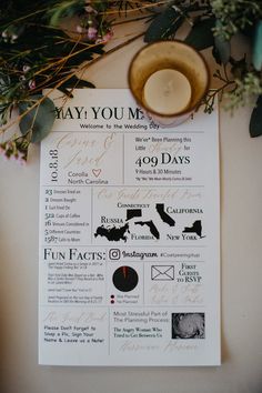 the wedding program is displayed on top of a table with flowers and greenery around it