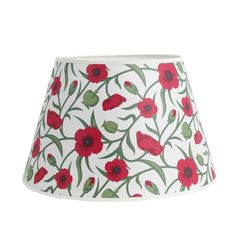 a red flowered lamp shade on a white background