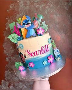 a birthday cake decorated with the characters from disney's lili - pooh