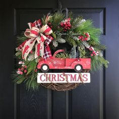 a christmas wreath with a red truck on it