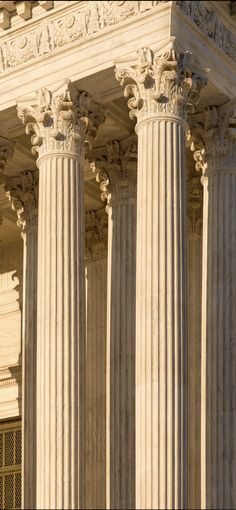 the supreme court building in washington, d c with columns and carvings on both sides