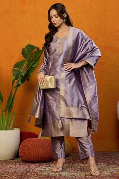 Grab this beautiful 3-piece set. The set comes with ethnic motif printed straight shape kurta has v neck, 3/4th sleeves & calf length teamed with solid trouser pant with side pocket and a dupatta. Color - Lavender Kurta Fabric-Silk Blend Pant Fabric-Silk Blend Dupatta Fabric - Silk Blend Neck-V Neck Sleeves-3/4th Sleeves Work -Ethnic Motif Print Detailing Washing Instructions-Dry Clean DISCLAIMER - The color of the product may be differ due to screen settings of device. A misprint here and a color drop slip there is the beauty of printing which is not treated as a defect. Indian Pants, Printed Suit, Lavender Silk, Fabric Silk, Churidar, Suit Set, Fabric Shop, Formal Wedding, Casual Party