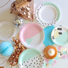 plates and decorations are arranged on the table