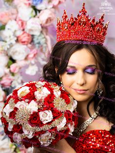 a woman wearing a tiara and holding a bridal bouquet in front of flowers