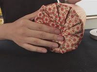 a person is holding an object in their hand