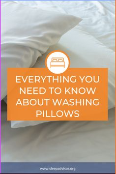 a bed with white pillows and an orange sign that says everything you need to know about washing pillows