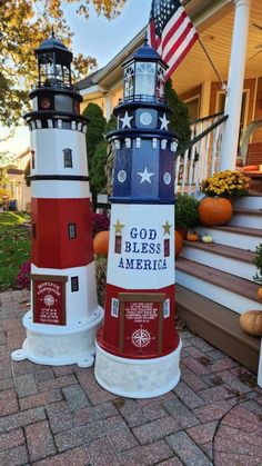 three lighthouses are painted red, white and blue with the words god bless america on them