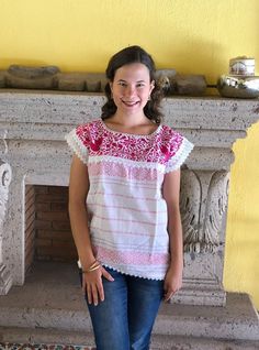 Beautiful traditional Mexican blouse made on a pedal loom with floral motifs, hand-embroidered in bright thread. These blouses have a unique embroidery so it can vary. Mexican textile art has centuries of history and creativity throughout the country. Mexico is recognized as one of the leading countries with a beautiful artistic production in the textile world, miraculous hands of talented artisans from different states of the country create stunning embroidery clothing, and various items. #Oaxa Traditional Floral Embroidered Festive Shirt, Embroidered Summer Festive Shirt, Traditional Cotton Shirt With Intricate Embroidery, Traditional Floral Embroidery Festive Shirt, Summer Festive Embroidered Shirt, Folk Style Embroidered Top With Woven Motifs, Cotton Peasant Blouse With Embroidered Neckline, Spring Folk Blouse With Woven Motifs, White Embroidered Bohemian Blouse Piece