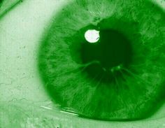 an eyeball is shown in green and black