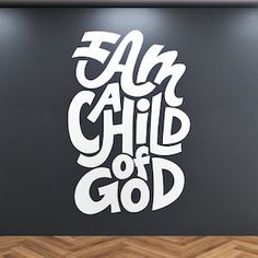 a wall with the words fam child of god written on it in white and black