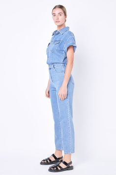 Make a statement in this stylish Short Sleeve Denim Jumpsuit! This jumpsuit has a classic silhouette with short sleeves and a front button-down closure plus two front pockets and a collared neckline for an edgy yet sophisticated look. Perfect for any season this jumpsuit is sure to drive sales and stand out from the rest. Add this unique piece to your wardrobe today! Short sleeves Front button down closure Pockets Collared Machine wash cold Do not bleach Tumble dry low Iron low if needed Shell: Short Sleeve Denim Jumpsuit, Short Sleeve Denim, Jumpsuit Fall, Sophisticated Look, Blazer And Shorts, Heat Styling Products, Tops Fall, Low Iron, Romper With Skirt