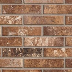 a brick wall that has been cleaned and stained brown