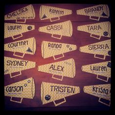 the name tags for several different types of items are arranged on a wooden table top