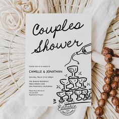 the couple's wedding stationery is laid out on a wicker tablecloth