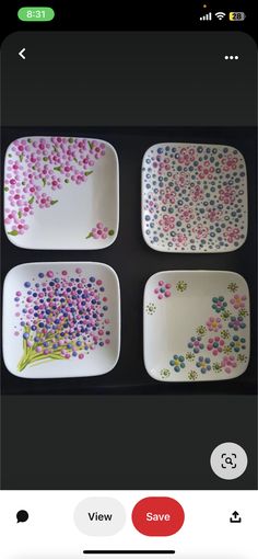 four square plates with flowers painted on them