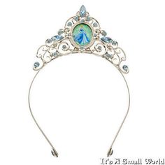 Disney Store Princess Cinderella Tiara for Girls Metal Headband NWT Disney Store Princess Cinderella Tiara for Girls Metal Headband NWT Crown her fairytale dreams with this dazzling Cinderella Tiara. A glittering cameo is framed by swirling silver metal forming Cinderella's pumpkin coach, while all around blue jewels add sparkle to her roleplay fantasy.  Cinderella cameo with glitter detailing Accented with faceted blue and clear jewels Metal headband Part of Disney's Cinderella Costume Col Cinderella Tiara, Princess Aurora Dress, Princess Fancy Dress, Pumpkin Coach, Disney Princess Costumes, Cinderella Pumpkin, Cinderella Costume, Girls Crown, Metal Forming